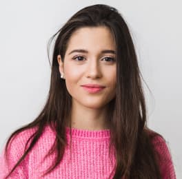 Smiling woman with dark, long, straight hair